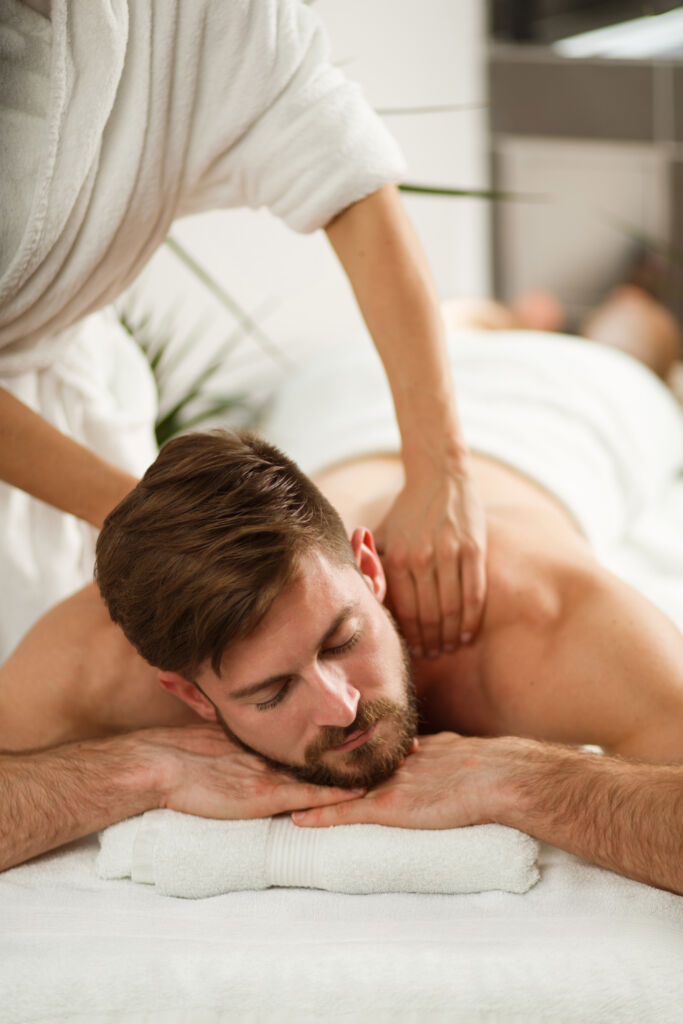 Man having back massage at the health spa. massage man